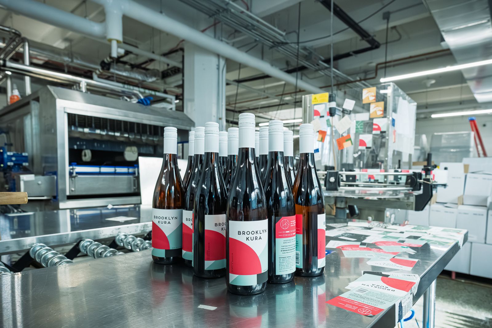 Freshly bottled Brooklyn Kura sake lined up on the bottling line