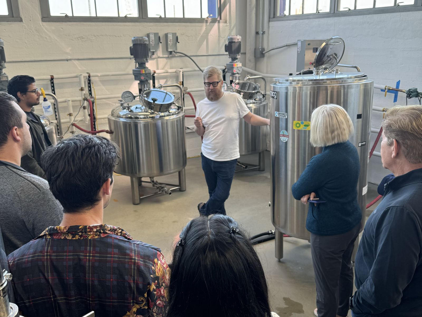 Our guide leading a brewery tour among the tanks at Brooklyn Kura