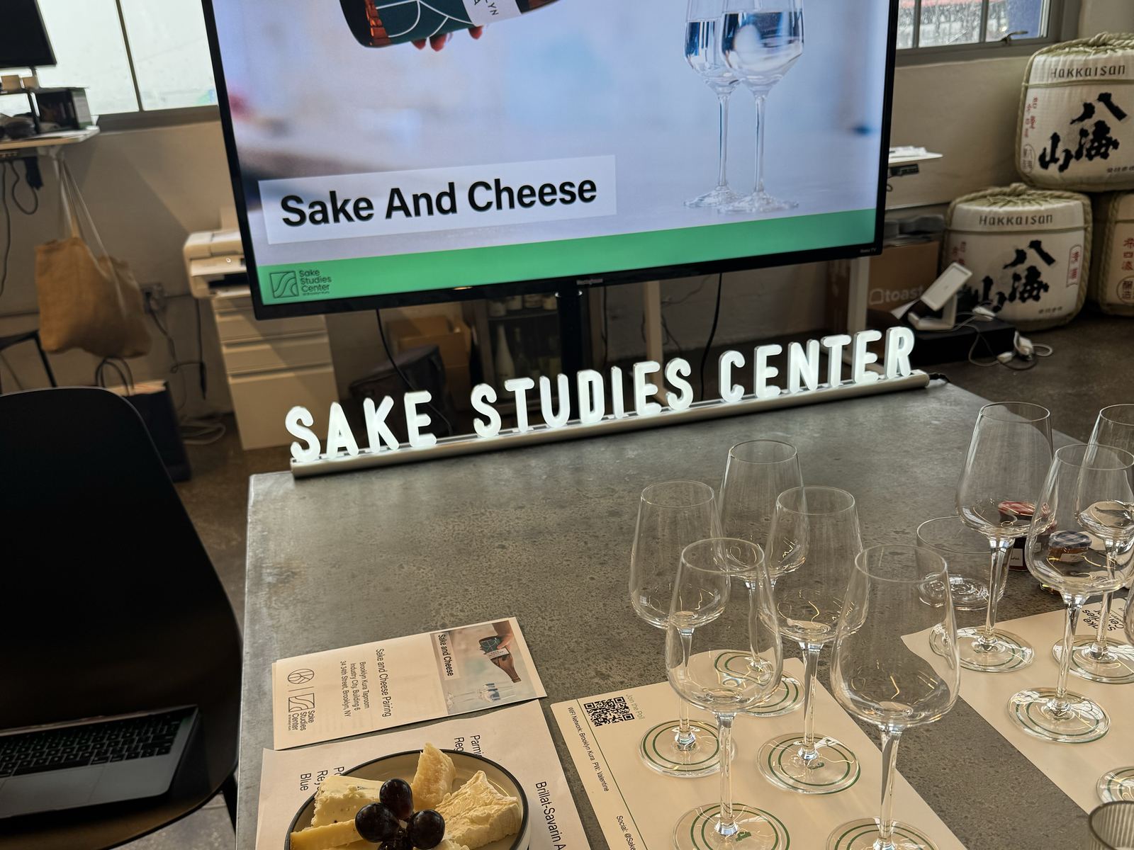 A cheese plate and tasting glasses ready as the Sake and Cheese class begins