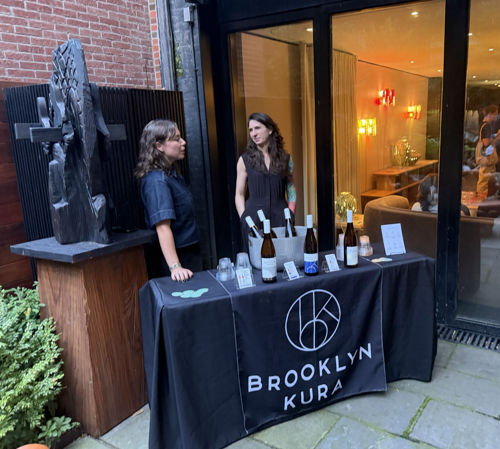 A Brooklyn Kura sake tasting table set up at an off-site venue
