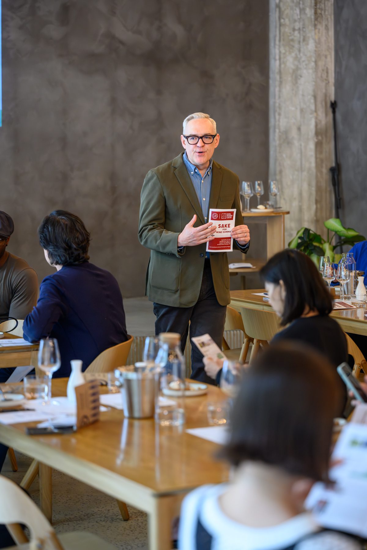 Welcoming guests to a previous Sake for Wine Somms luncheon, menu in hand