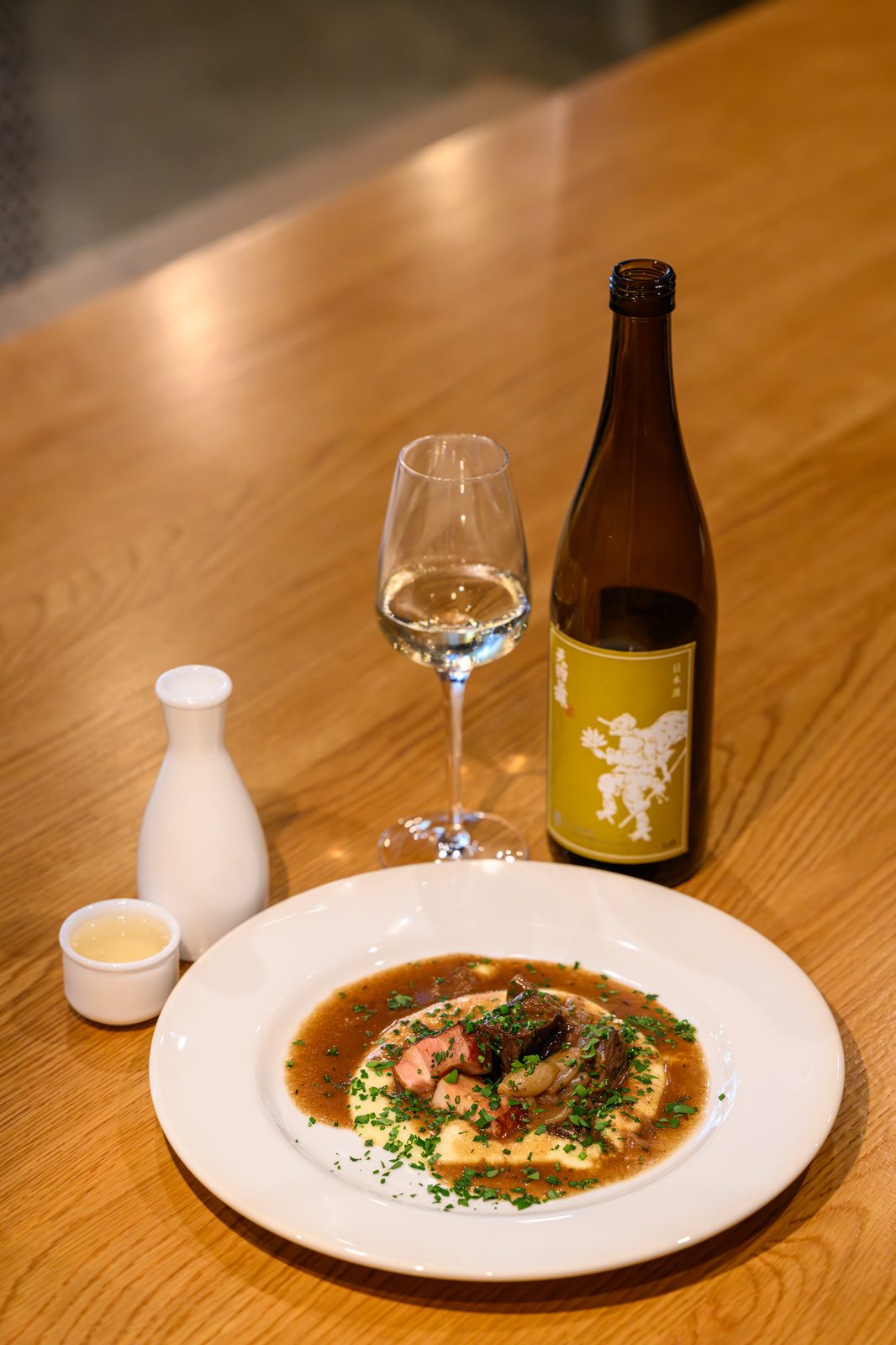 A hearty braise over polenta, paired with Tengumai